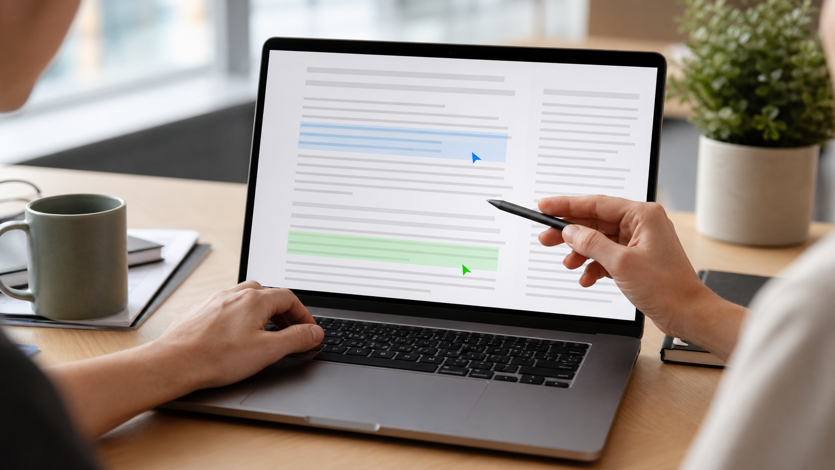 A shared document being edited in real time: a screen showing two colored cursors with name labels typing on