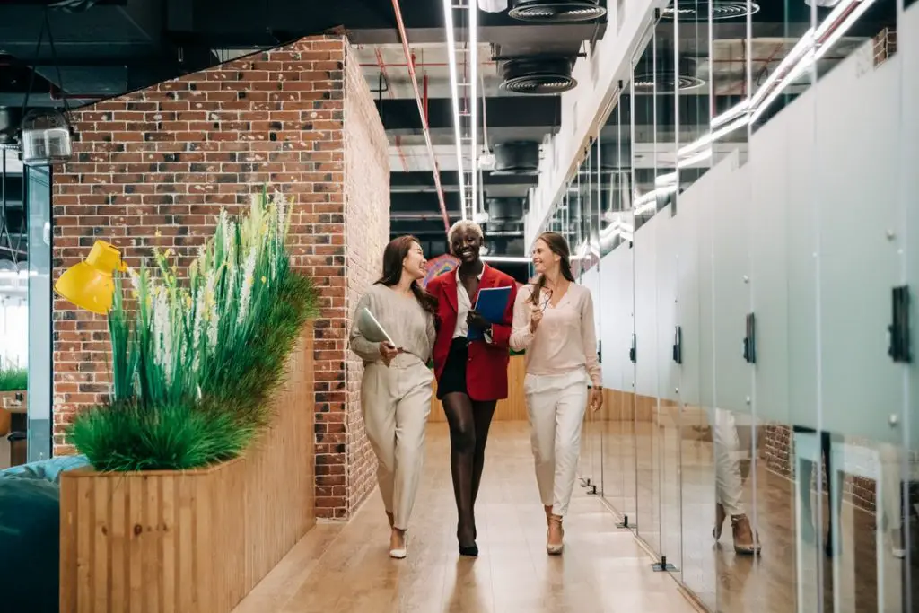 A group of people walking down a hallway