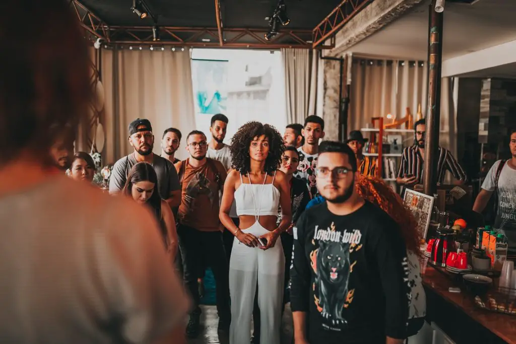 Diverse people listening to a speaker 