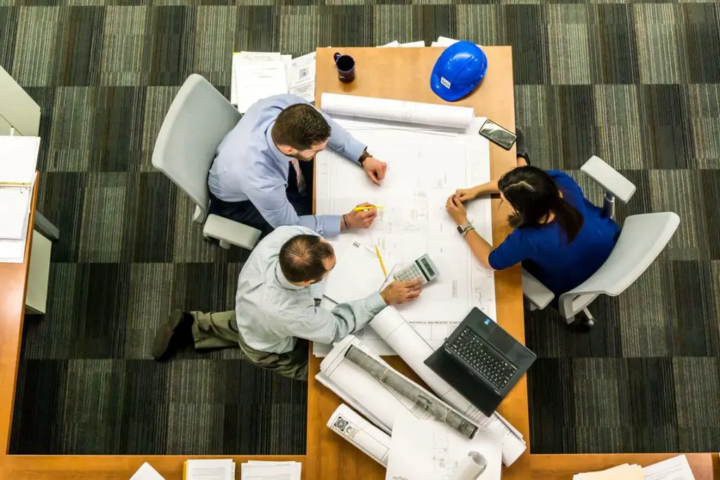 A bunch of items is sitting on a table—management team. 