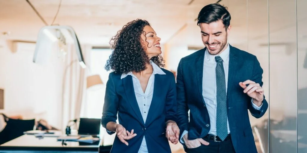 Communicating Upwards: Definition, Benefits, and Example 4 Smiling Business People