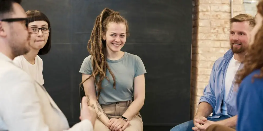 Group of men and women in a focus group discussion