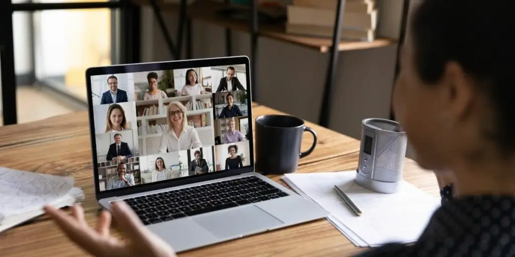 Video meeting on a laptop screen, zoom app