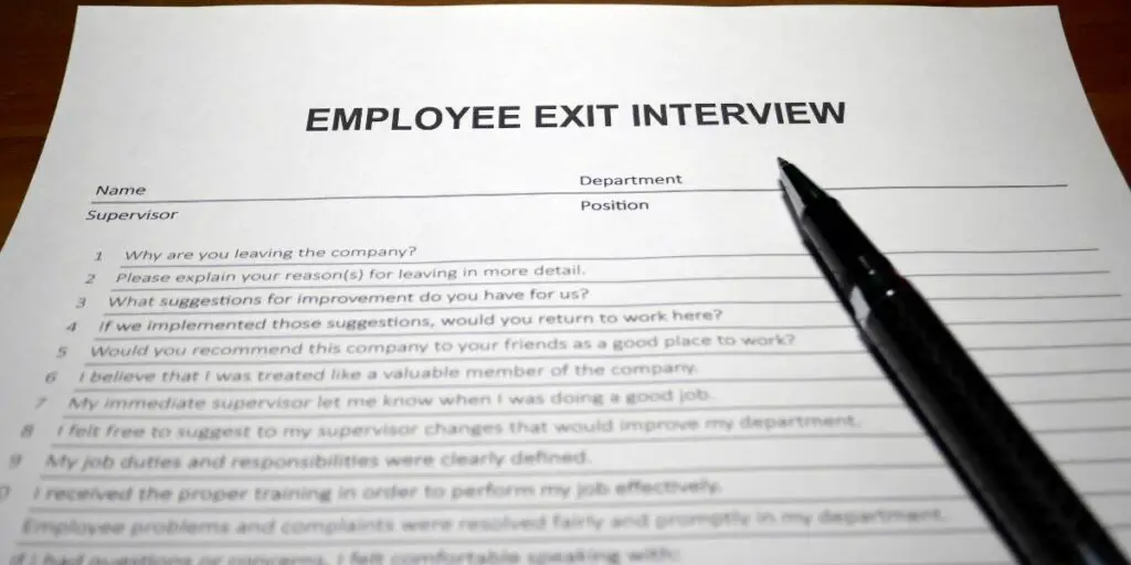 Someone filling out employee exit interview