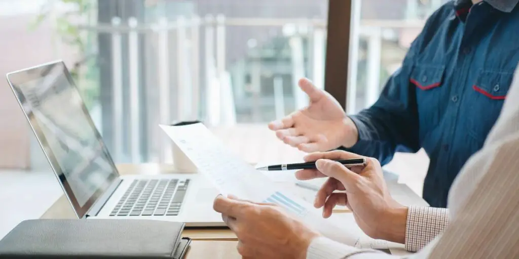 Business Colleagues Reviewing Reports