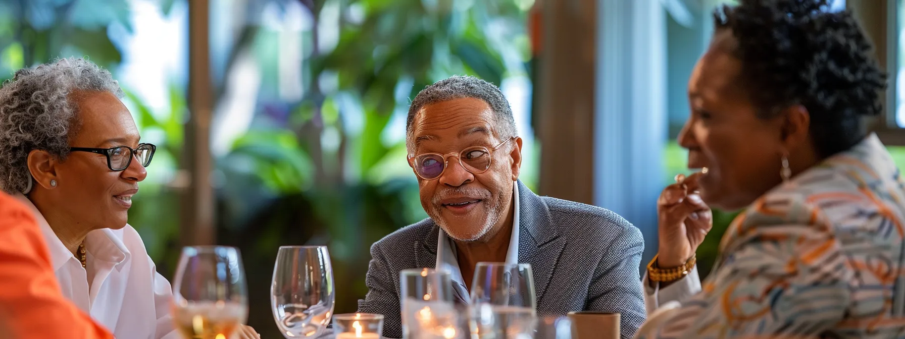 a group of diverse leaders gathered around a table, engaged in deep conversation and sharing valuable insights to support each other's growth and development.