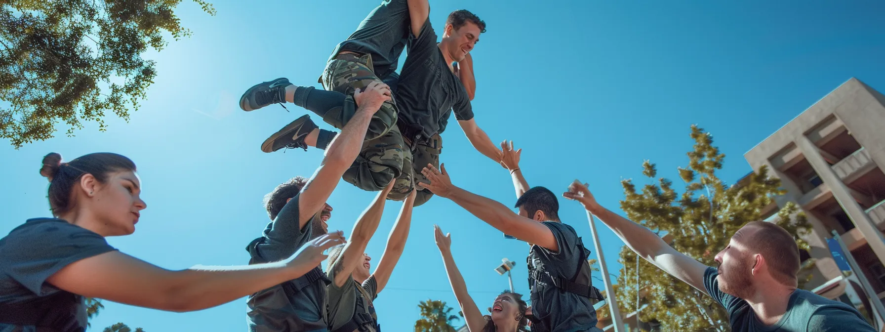 a team engaged in a trust fall exercise, building unity and camaraderie through mutual support and vulnerability.