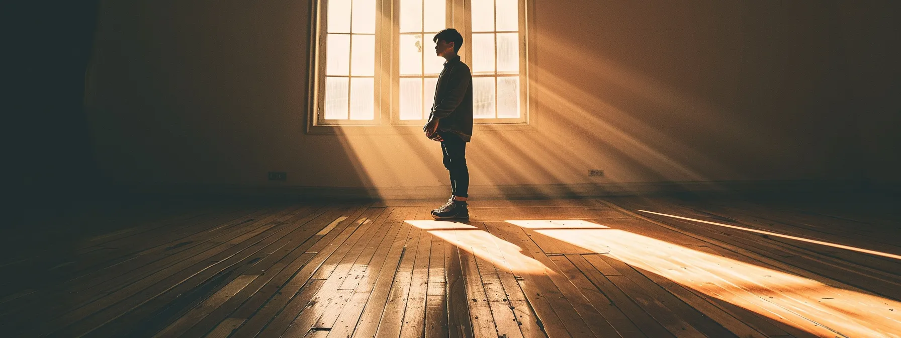 a person standing alone in a dimly lit room, surrounded by shadows, looking overwhelmed and isolated.