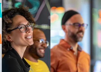 a group of diverse professionals engaged in a brainstorming session, surrounded by colorful sticky notes and whiteboards filled with creative ideas.