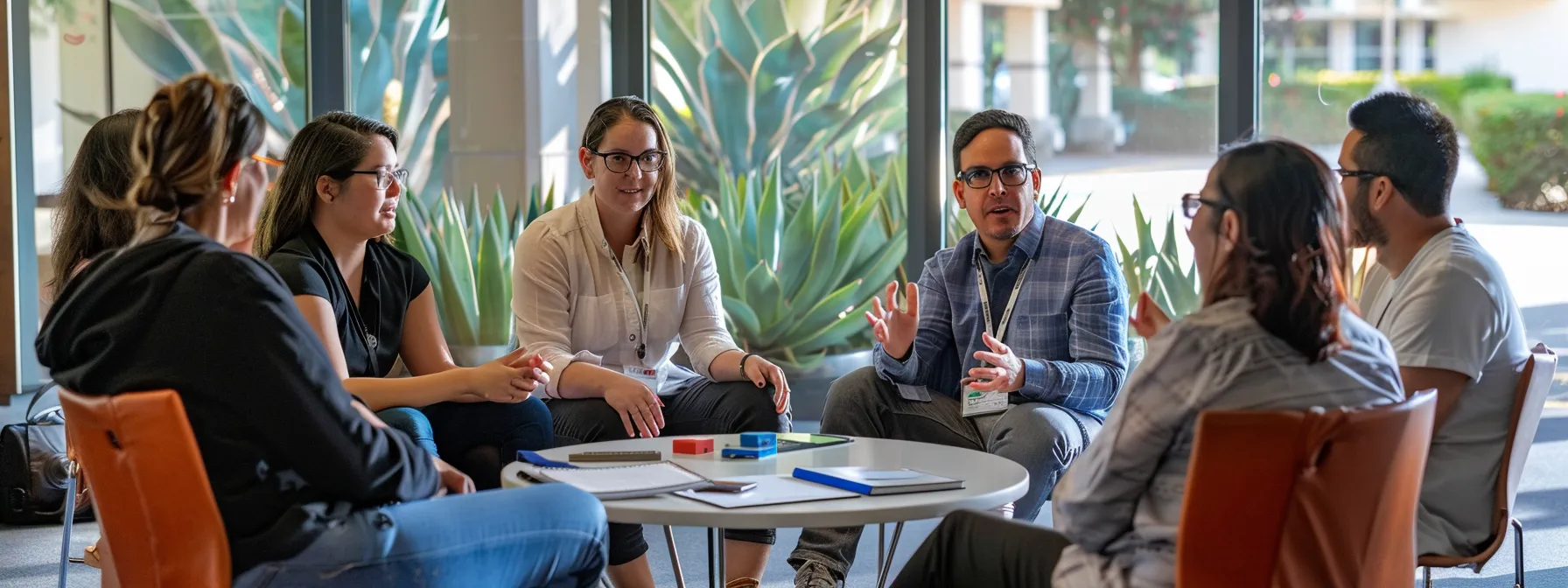 a group of professionals engaged in a collaborative coaching session, fostering teamwork and creativity.