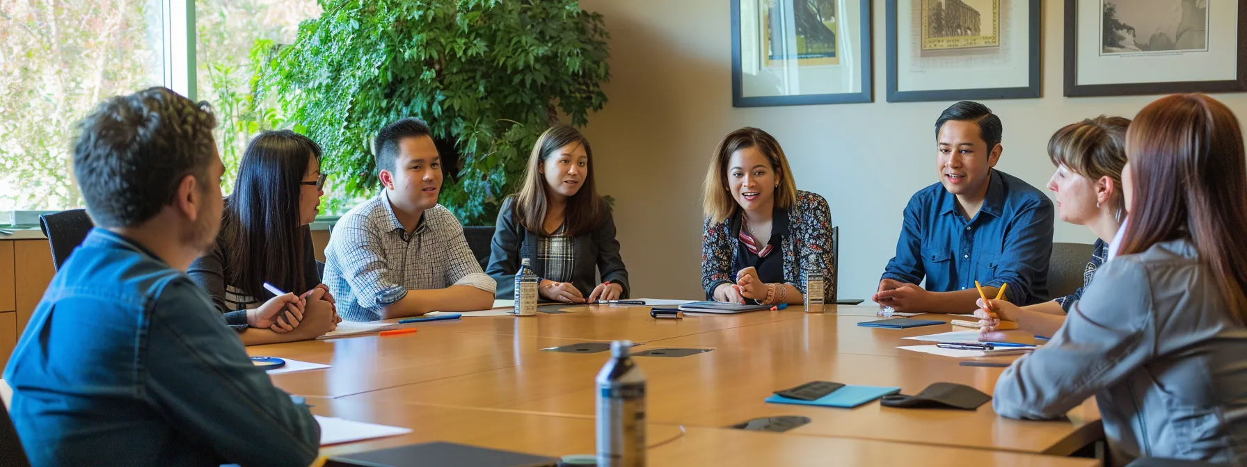 a diverse group of coworkers engaged in a productive and respectful discussion around a conference table, emphasizing teamwork and effective communication to address workplace issues and promote a positive work environment.