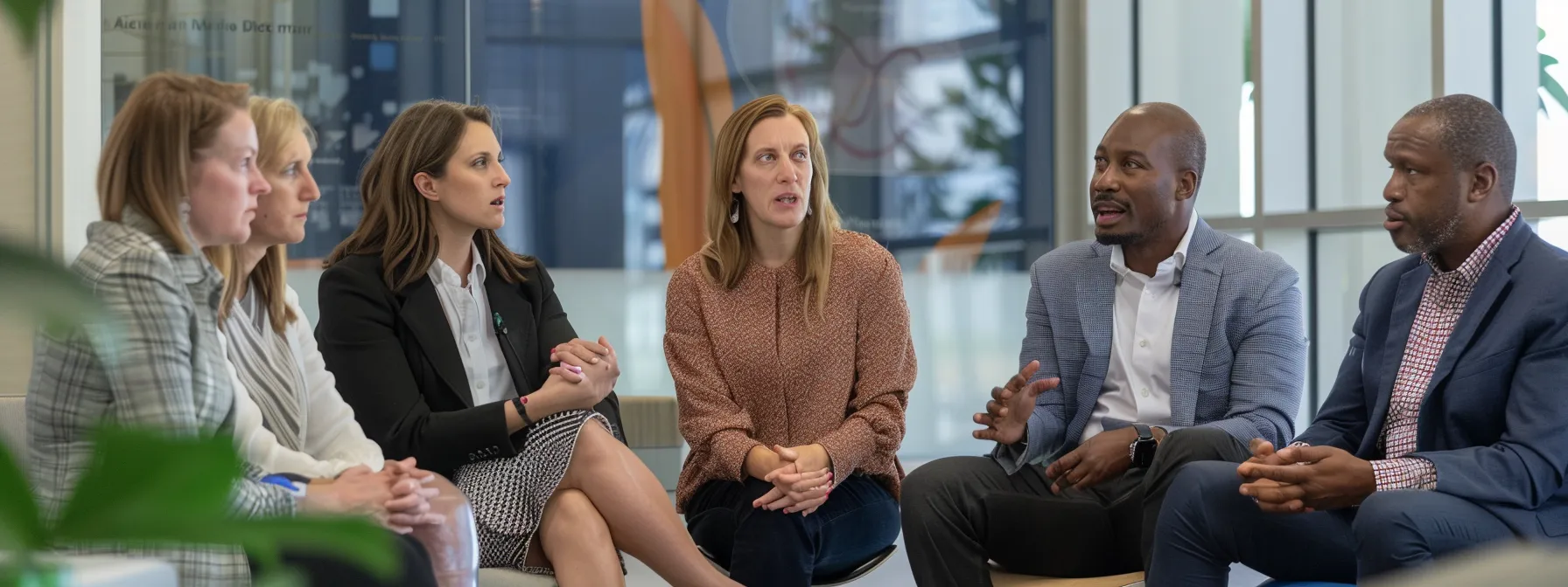 a diverse team of professionals engaged in a heated but respectful discussion, with focused expressions and attentive body language, illustrating effective conflict resolution strategies.