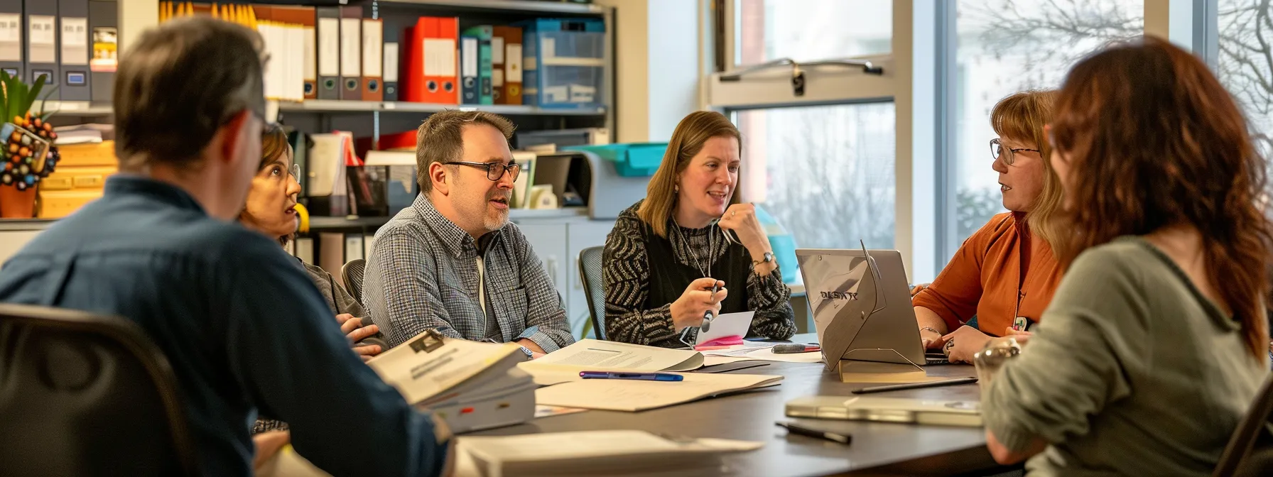 a group of employees confidently engaging in a discussion with their union representative, surrounded by folders of well-organized documentation.