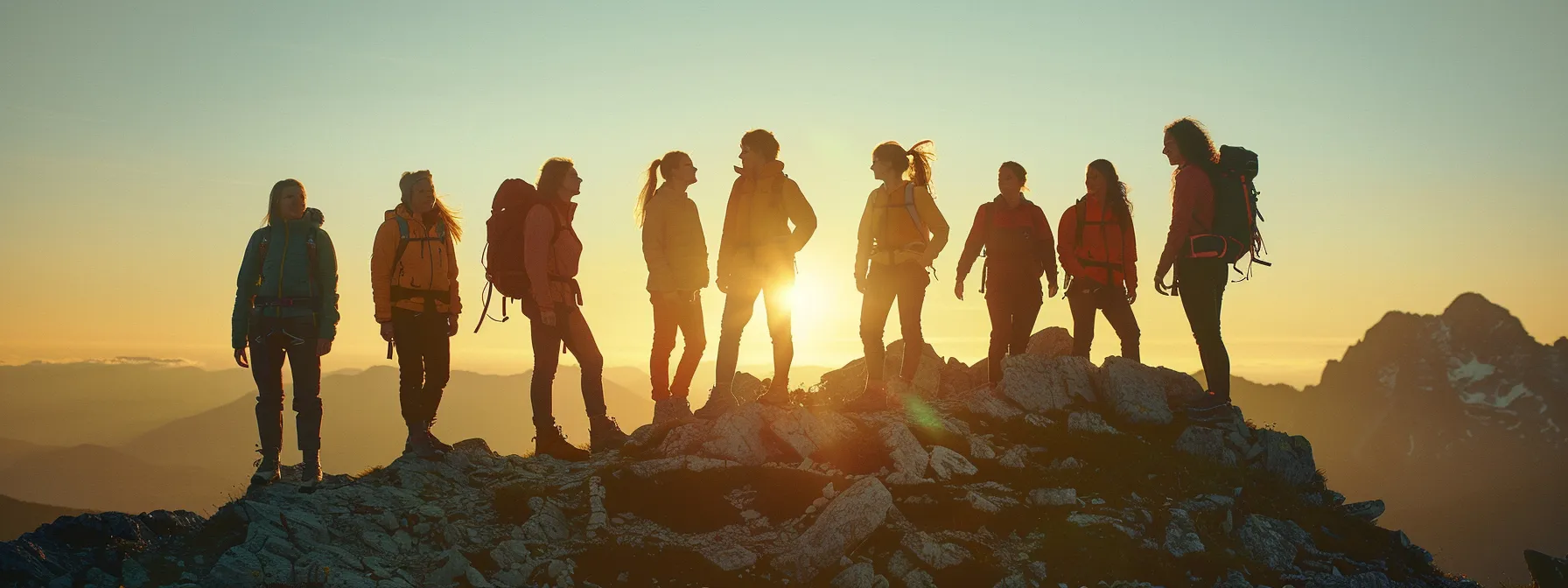 a group of strong, determined women standing at the summit of a mountain, representing courage and resilience in sports and exploration.