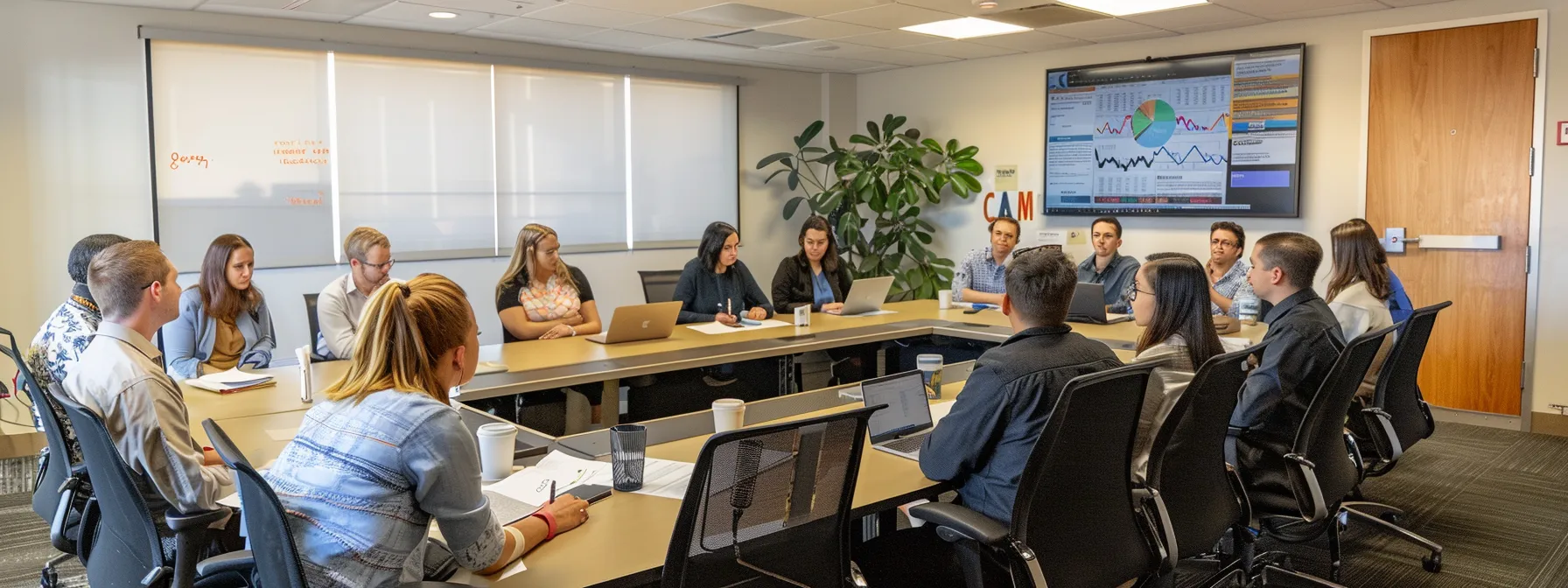 a group of employees in a conference room reviewing and updating retention policies under a compliance poster.