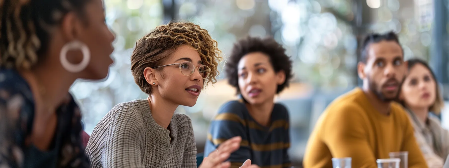 a diverse team of professionals engaging in a productive, open discussion during a team meeting.